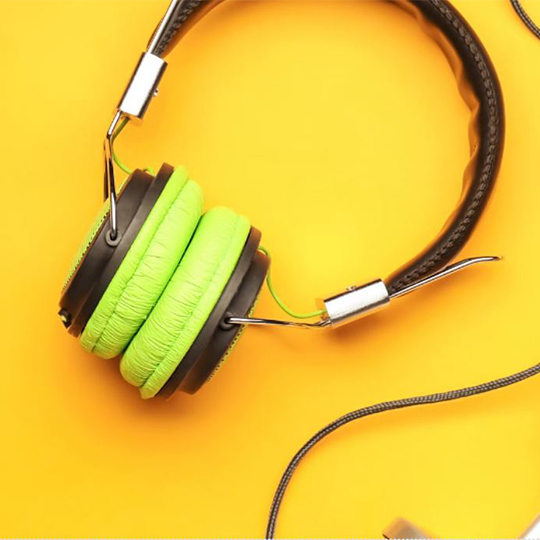 Earphones with yellow background